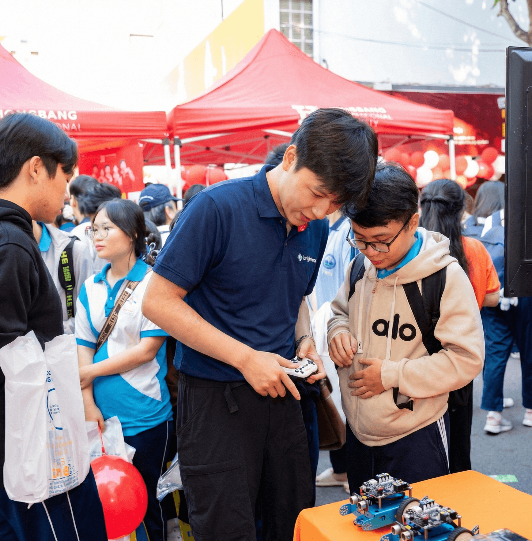 AIPA Lab robotics research event with students and engineers demonstrating humanoid robot technology